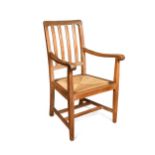 A Heal's limed oak elbow chair,