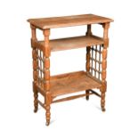 Leonard Wyburd for Liberty & Co., an oak three tier book or side table, circa 1900,