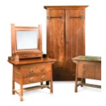 An Arts & Crafts walnut bedroom suite, possibly by Shapland & Petter,