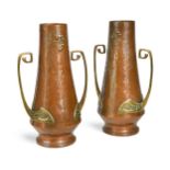 A pair of WMF twin-handled copper and brass vases, circa 1900,