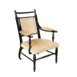 An Aesthetic movement elbow chair in the manner of E. W. Godwin (1833-1886),