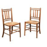 A pair of Arts & Crafts rush seated side chairs
