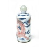 A Chinese under-glaze blue and red snuff bottle, Qing Dynasty, 19th century,