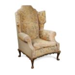 A Queen Anne style walnut framed wingback armchair, 19th century,
