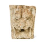 A Medieval keystone of a lion mask,