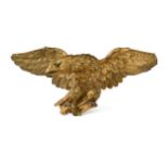 A carved giltwood eagle, 19th century,