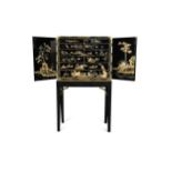 A Chinese black lacquer cabinet on later stand, 19th century,