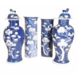 A near pair of Chinese blue and white prunus and crackled ice baluster vases, Qing Dynasty,