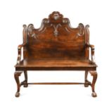 A Portuguese oak and fruitwood high back hall seat, 19th century,