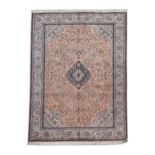 A Persian silk rug,