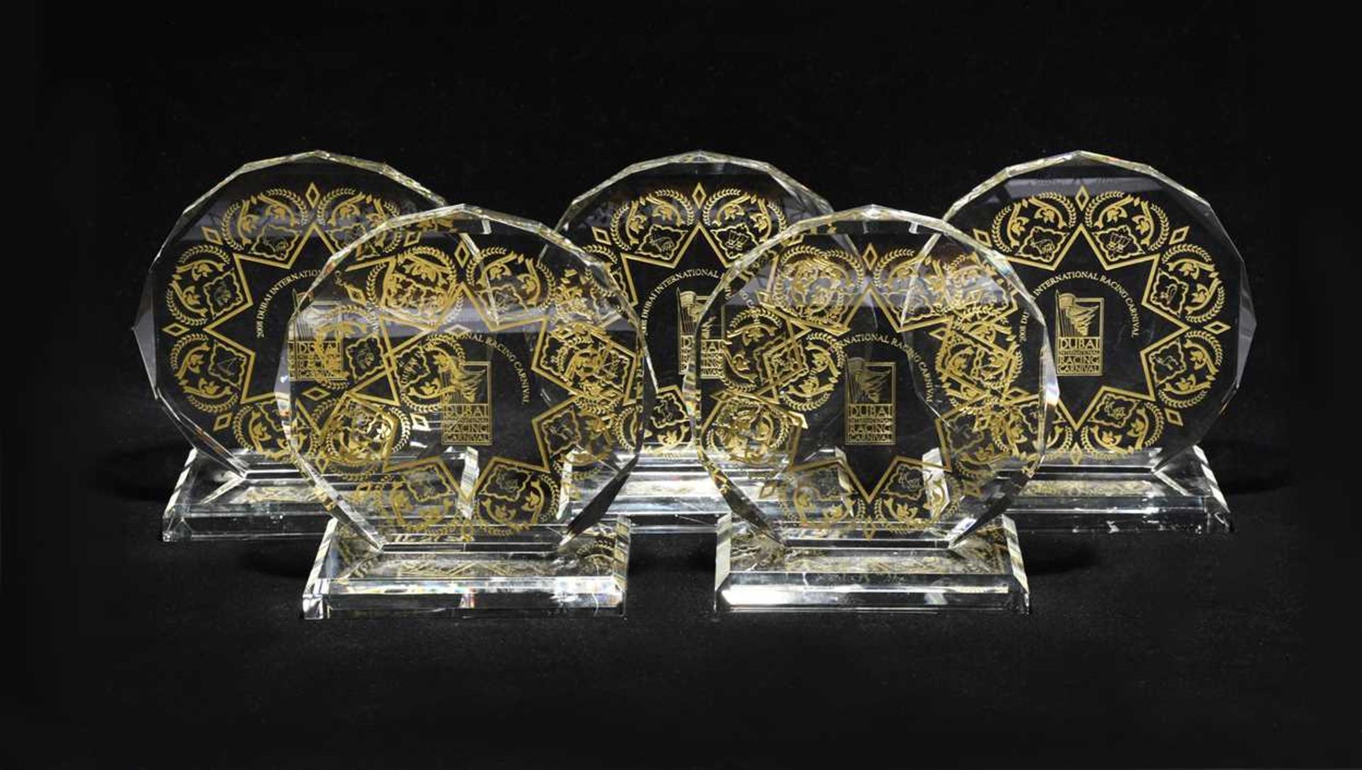 A group of glass Dubai International Racing Carnival trophies, awarded to Frankie Dettori,