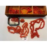 A collection of coral necklaces, a coral bracelet, a coral brooch and a quantity of loose coral