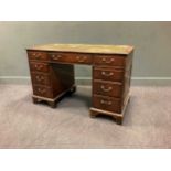 An early 20th century pedestal desk 77 x 122 x 62cm together with an Edwardian walnut revolving