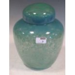 A blue and green spatter glass blown glass ginger jar and cover, 26cm high