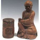 A late 19th or early 20th century Chinese carved root wood figure of a man, possibly Shoulao, 26cm