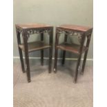A near pair of Chinese hardwood tall side tables with lower tier (one leg broken), 80 x 42 x