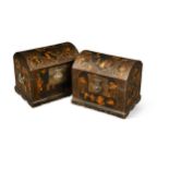 A pair of Chinese black and gold lacquer papier-mâché domed boxes