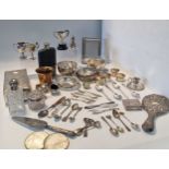 A large collection of silverware including flatware, sauce boats, bowls, cigarette boxes, napkin