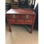 A Chinese red lacquered table with two frieze drawers and brass mounts, 80 x 87 x 59cm