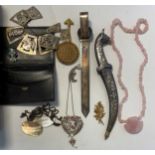 A collection of beads and costume jewellery, with some jewellery boxes