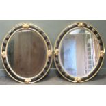 A pair of 20th century gilt and black oval wall mirrorsthey all are the same size 110 x 92 x cm