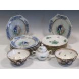 A set of eight octagonal and circular armorial plates, the rims with blue foliate decoration, one