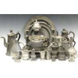 A collection of 19th century and 20th century pewter wares including dishes and other vessels, of