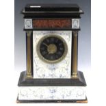 A Victorian slate mantel clock the ebonised and gilt dial with Roman chapter ring and decorated with