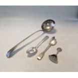 An 18th century silver soup ladle, together with a Scottish and an Irish silver spoon and a