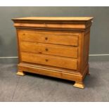 A Continental Biedermeier style fruitwood commode, comprising of a frieze drawer over three long