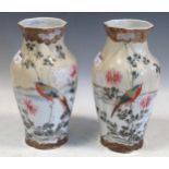 A pair of Japanese octagonal vases with bulbous relief-shaped reserves to the main body, decorated