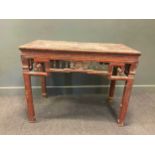 A Chinese red lacquered hardwood carved centre table, 88 x 112 x 60cm