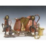 Decorative metalware including fire irons, copper jugs, Goodell apple peeler, brass log bin, pair