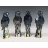 Four earthenware blue glazed birds, approx 32cm high