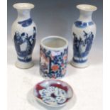 A pair of Chinese blue and white Kangxi style porcelain baluster vases, decorated with scholars