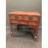 A Chinese red and gilt painted table with two frieze drawers, 88 x 87 x 55cm