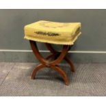 A continental stool with needlework top on X pattern supports, 50 x 41 x 36cm