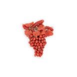 A carved coral brooch,