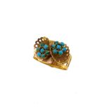 A turquoise dress ring,