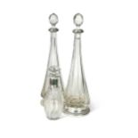 A pair of French metalwares silver mounted cut glass decanters together with another example,