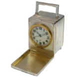 Unsigned - A Sterling silver travelling clock with unusual front cover and rear compartment,