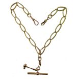 An 18ct gold watch chain with attachment,
