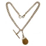 An early 20th century 9ct rose gold watch chain with attachment,