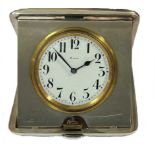 Octava Watch Company, Granges - An early 20th century Sterling silver cased 8 day travelling clock,