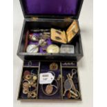 A jewellery box containing a collection of jewellery including a locket tested as 9ct gold weight