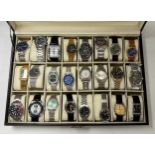 A collection of 36 fashion watches housed in 2 presentation cases together with a further assorted