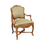 A French Regence beech framed armchair,