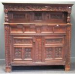 An early 18th century oak court cupboard, later carved and adapted, 181cm high, 179cm wide