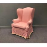 A George III style mahogany frame wing armchair, upholstered in pink fabric, 112 x 85 x 80cm