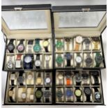 A collection of 40 fashion watches housed in 2 presentation cases